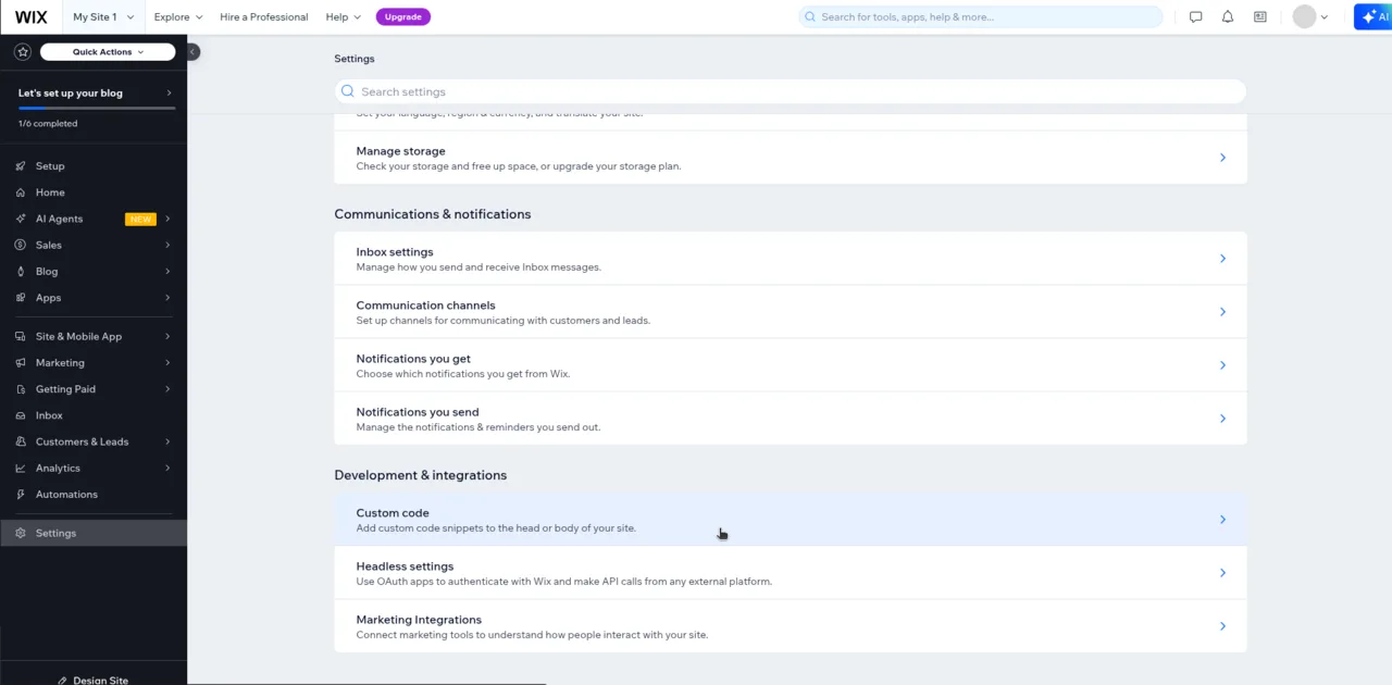 Wix site dashboard Settings page with Custom code highlighted under Development & integrations